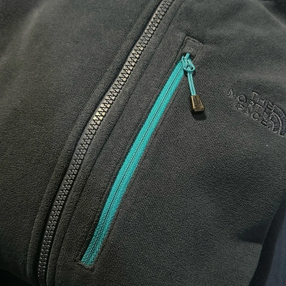 The North Face Navy Blue Fleece with Teal Accent Pocket and Dark Gray Side Panel